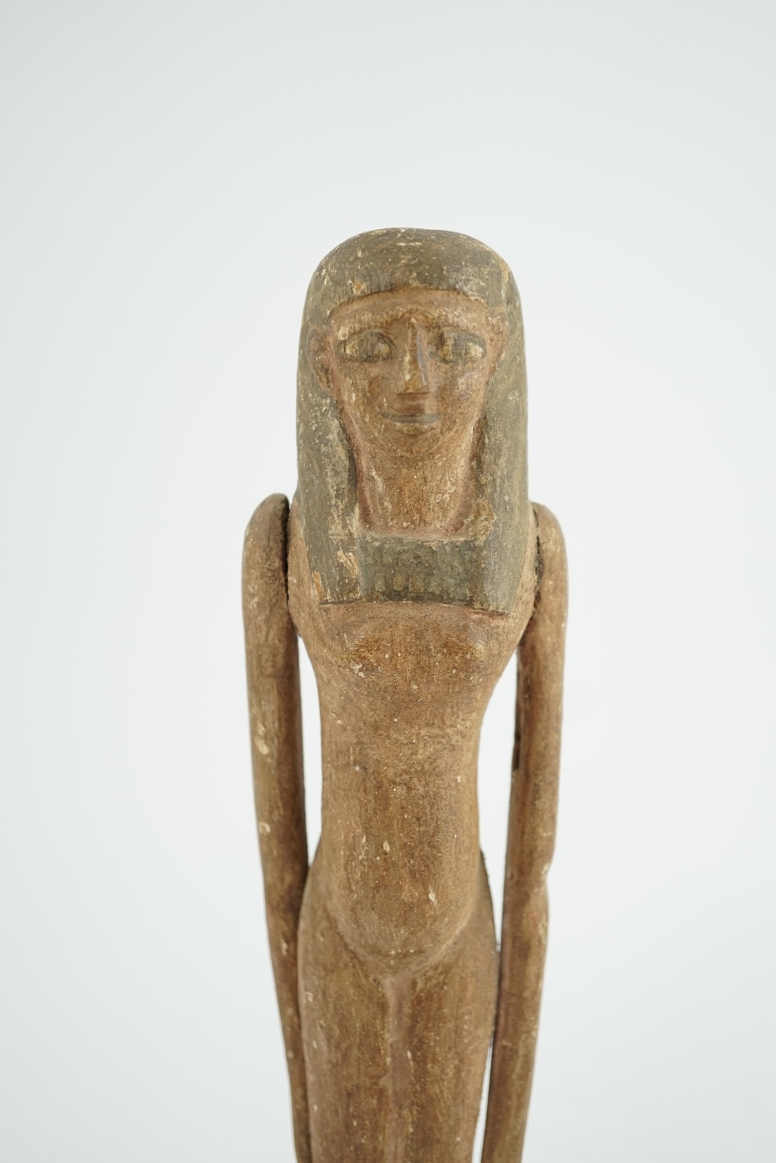 An Egyptian painted gesso and wood portrait statuette of a woman, probably Middle Kingdom, 12th dynasty, 1991-1802 BC